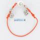 Bracelet élastique orange 2 charms et oeil de sainte lucie